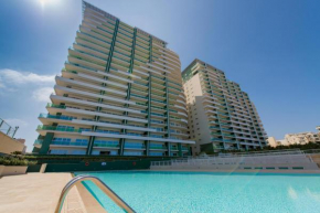 Luxury Apt w/ Side Seaviews and Pool, Top Location